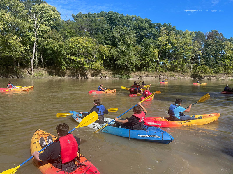 Customers paddling around on the Auglaize river in their kayaks. No need to bring your own, we've got plenty to go around!