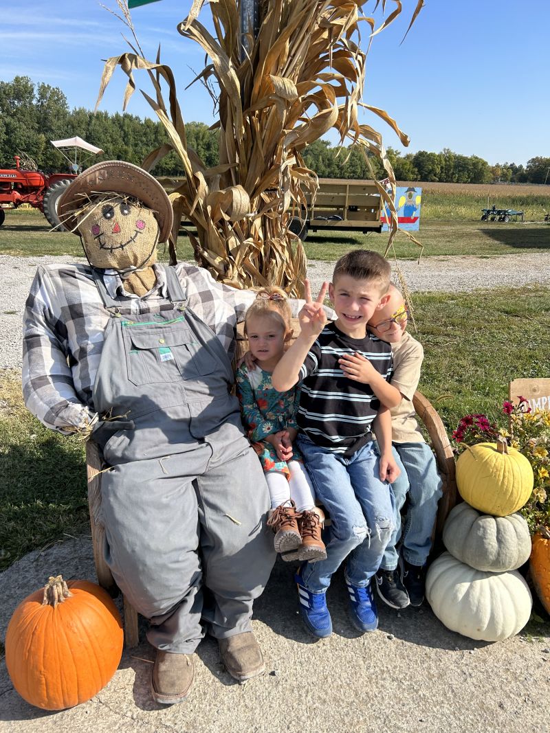 Kids stop for a memorable photo with one of our friendly scarecrows.